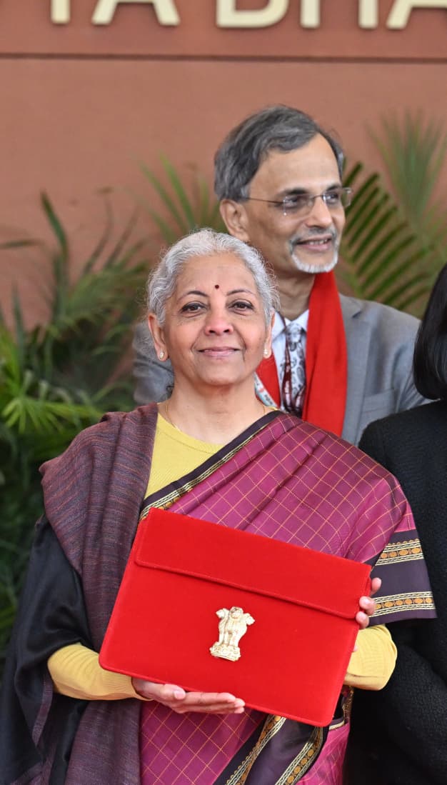 Budget 2026 live updates Nirmala Sitharaman arriving at Parliament House for Budget 2026 holding red tablet